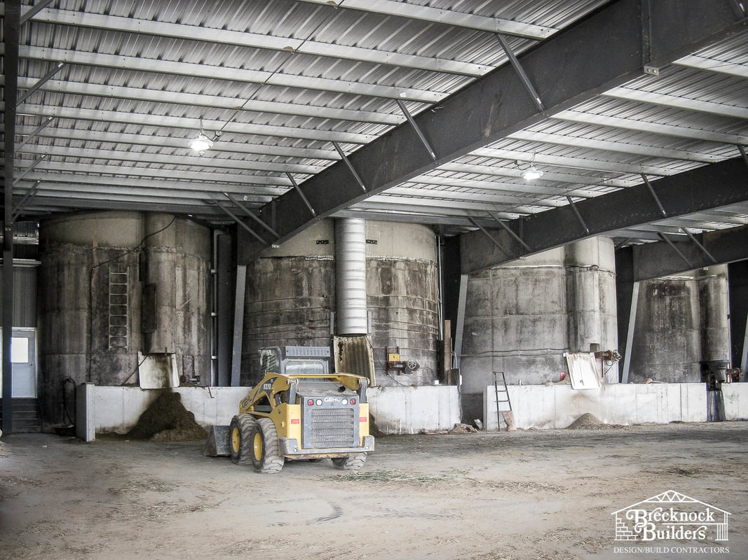 Inside Pre-engineered metal building connected to farm silos
